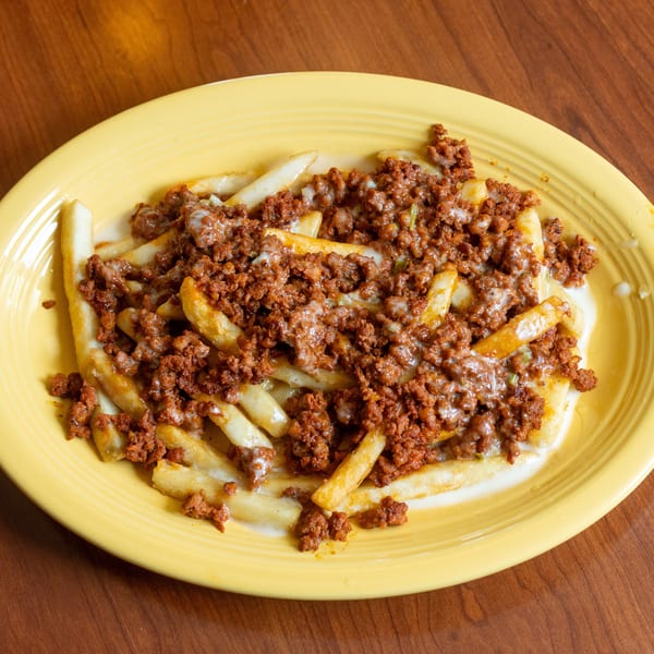 Chorizo fries, golden french fries topped with seasoned ground chorizo and melted white cheese.
