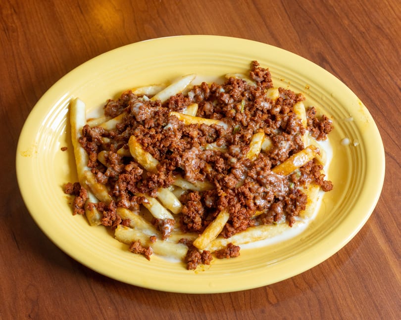 Chorizo fries, golden french fries topped with seasoned ground chorizo and melted white cheese.